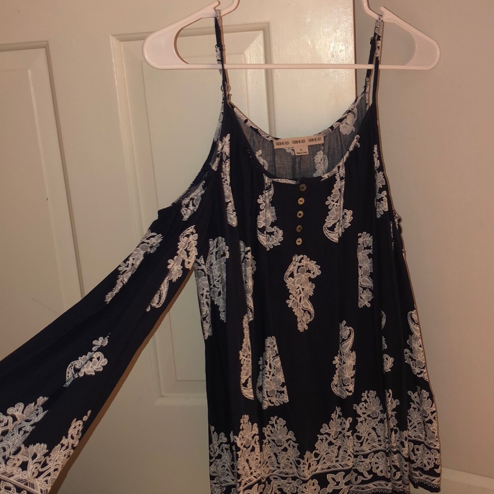 Over the shoulder blue and white long sleeve shirt